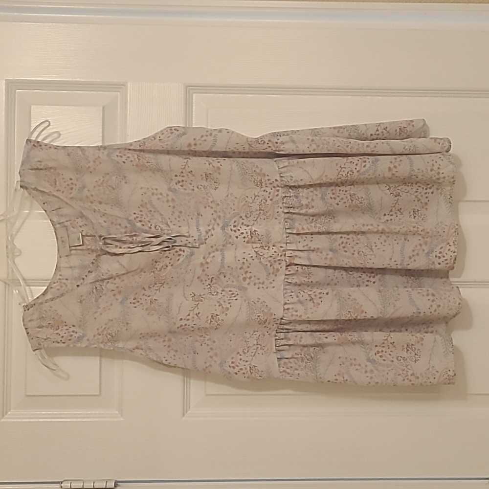 Floral babydoll/peplum style sleeveless blouse